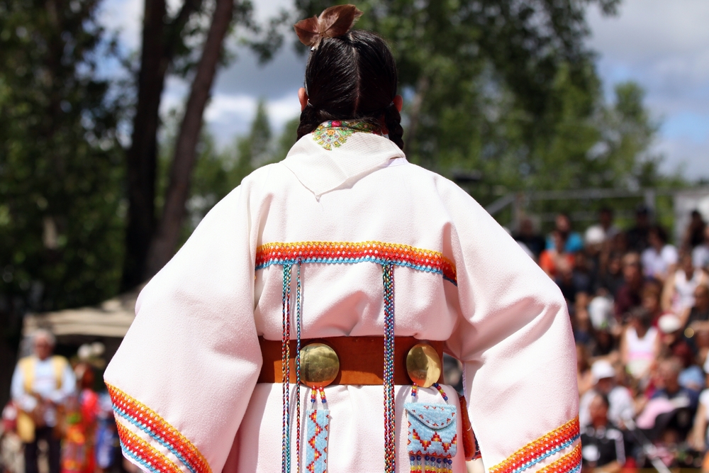 Photo of Native American woman in traditional costume.