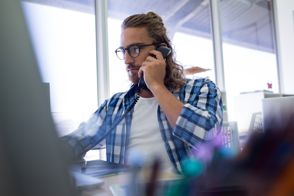 Male executive talking on phone