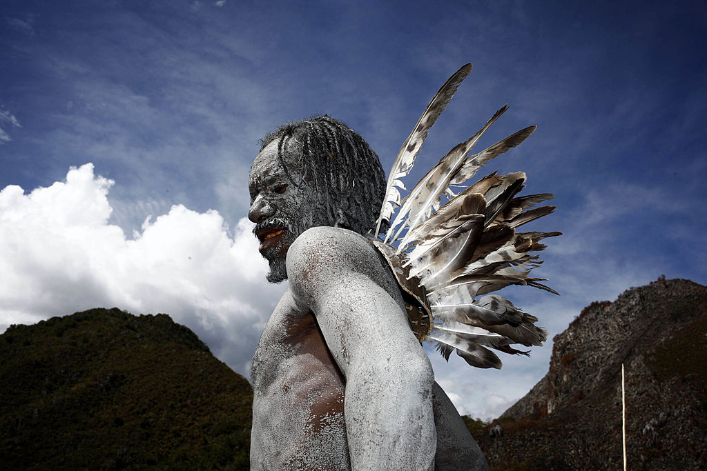 A Papuanese tribal man stands during the Baliem Valley Festival