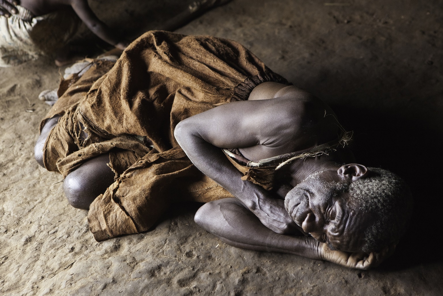 James is acting out a traditional story in the village of Mukuno, Uganda.