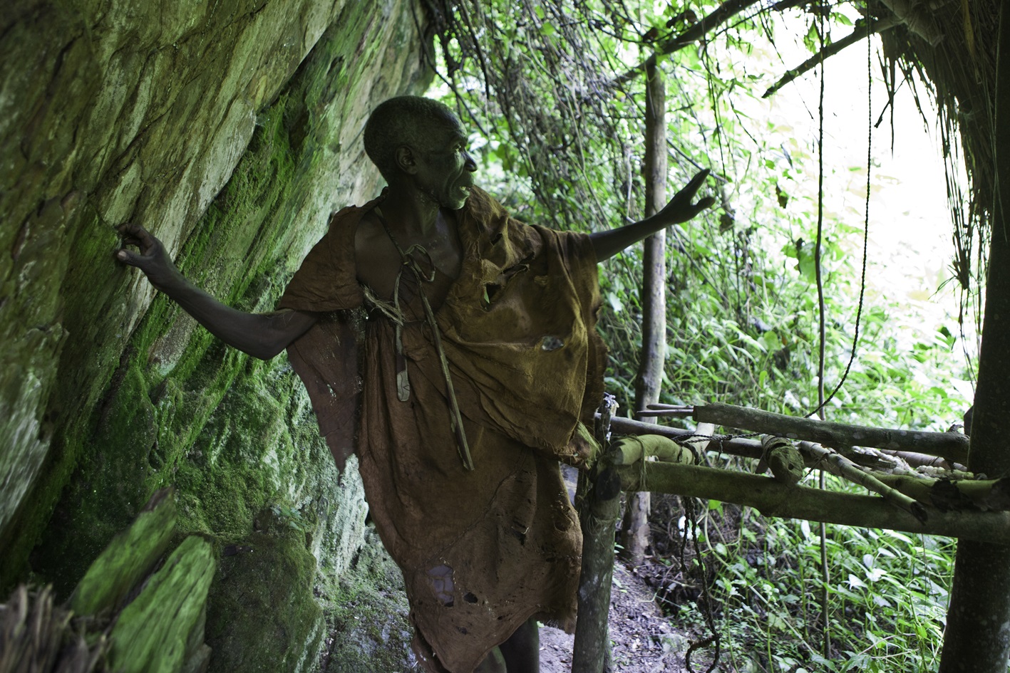 Batwa pygmies from the Bwindi Impenetrable Forest in Uganda demonstrates where they used to live