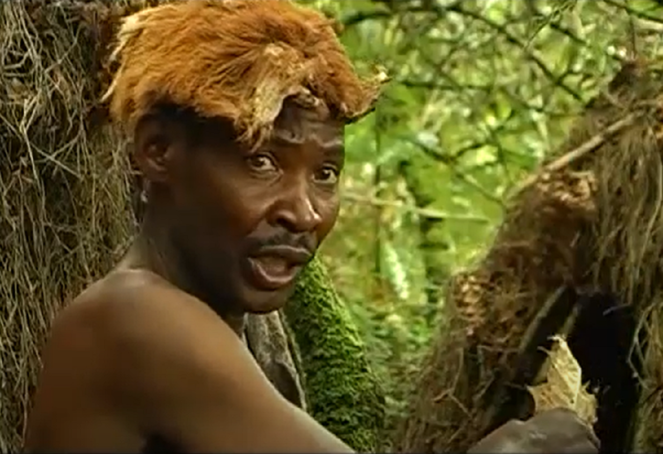 Screenshot of Batwa tribe man - from The Batwa Legacy (2011)