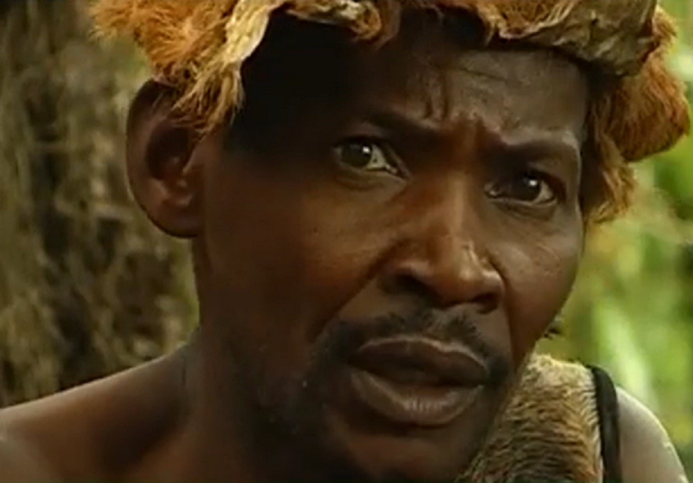 Screenshot of Batwa tribe man looking upset - from The Batwa Legacy (2011)