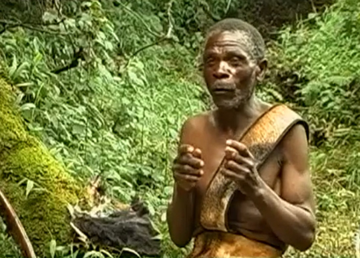 Screenshot of Batwa tribe man in the forest - from The Batwa Legacy (2011)