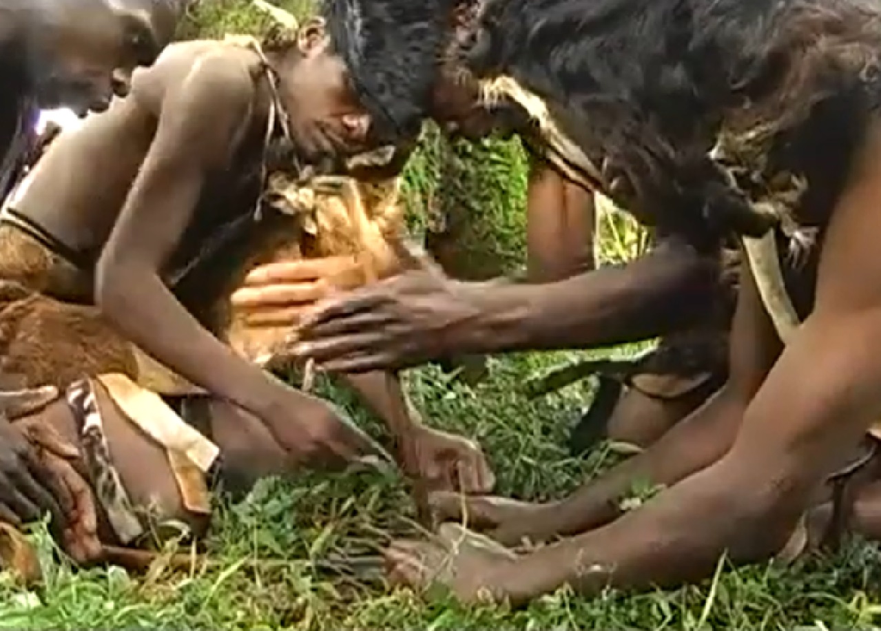 Screenshot of Batwa tribe man in the forest - from The Batwa Legacy (2011)