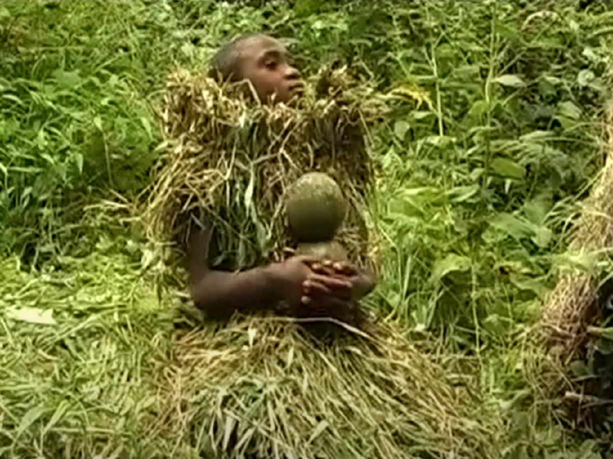 Screenshot of Batwa tribe people - from The Batwa Legacy (2011)