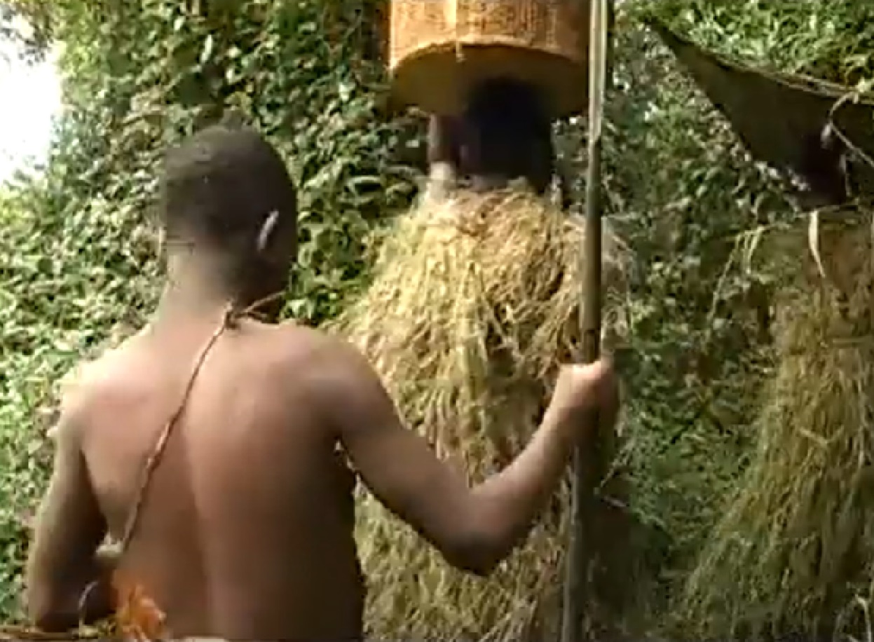 Screenshot of Batwa tribe man in the forest - from The Batwa Legacy (2011)