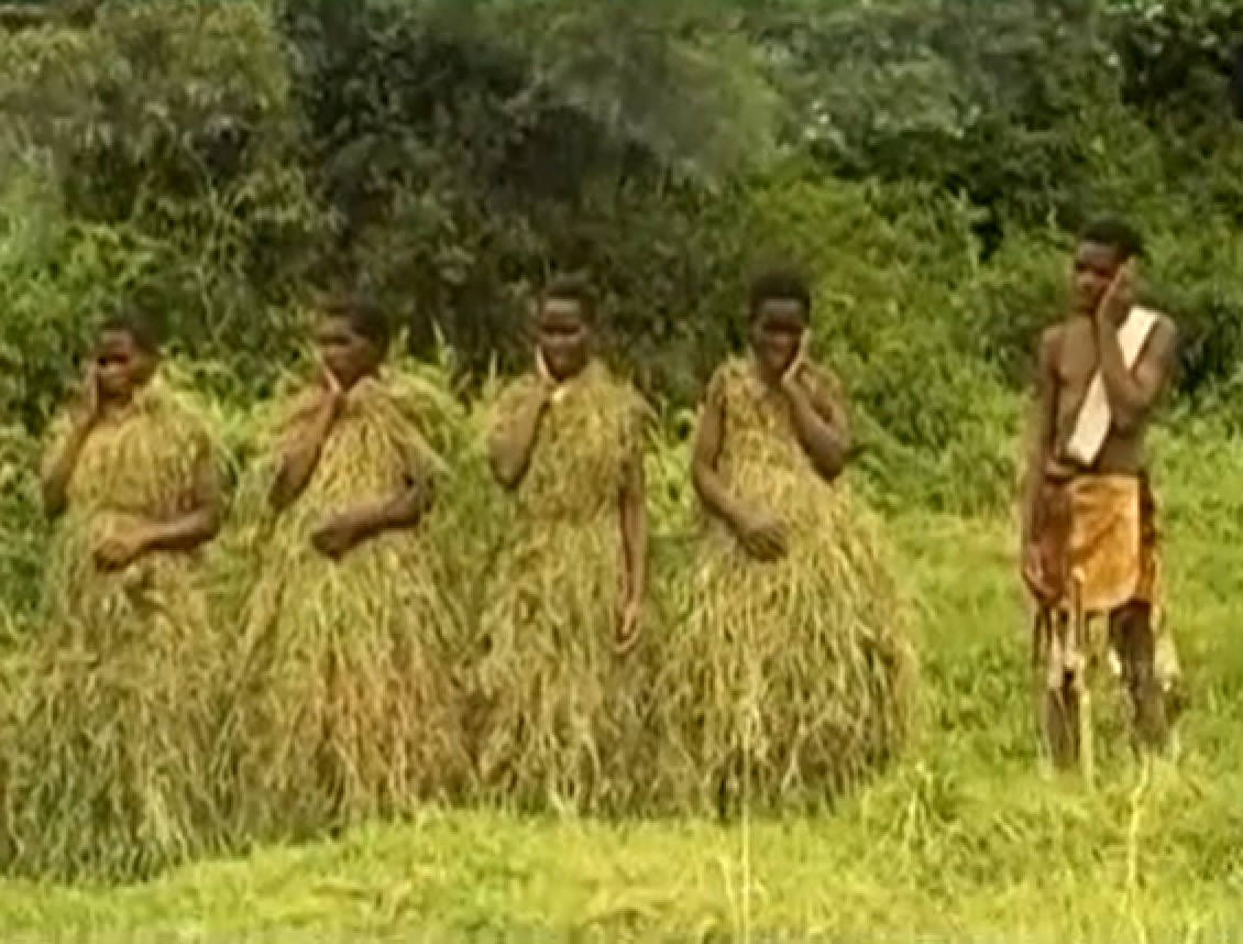 Screenshot of Batwa tribe people in the forest - from The Batwa Legacy (2011)