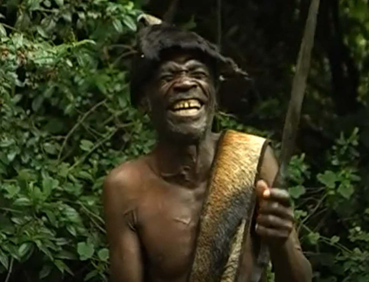 Screenshot of Batwa tribe man smiling - from The Batwa Legacy (2011)