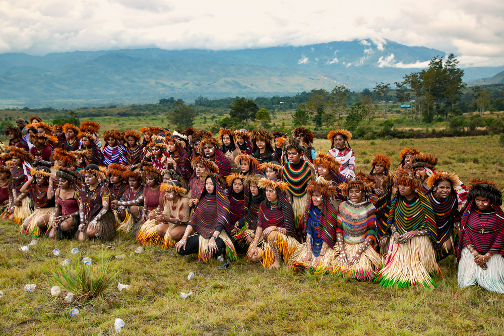 Young girls of a papuan tribe in a beautiful crown