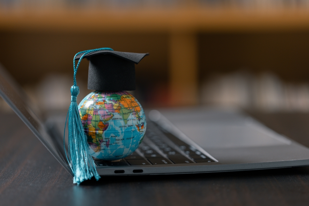 Graduation cap with Earth globe