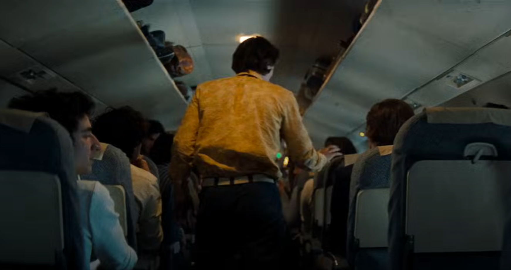 Screenshot of people on board on Flight 571 - from Society of the Snow (2023)