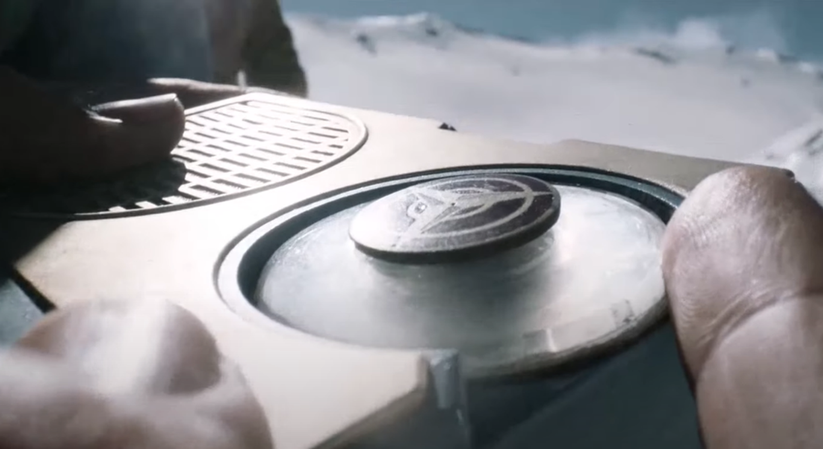 Screenshot of man holding AM radio - from Society of the Snow (2023)
