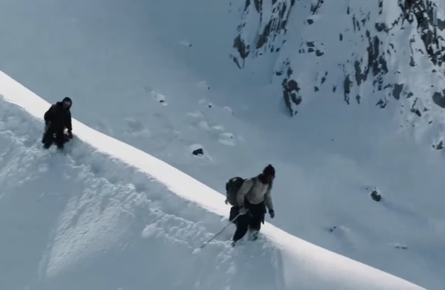 Screenshot of people walking on the snow - from Society of the Snow (2023)