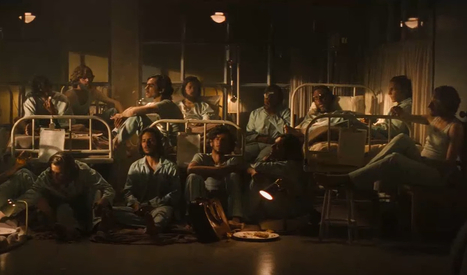 Screenshot of survivors from Flight 571 in hospital - from Society of the Snow (2023)