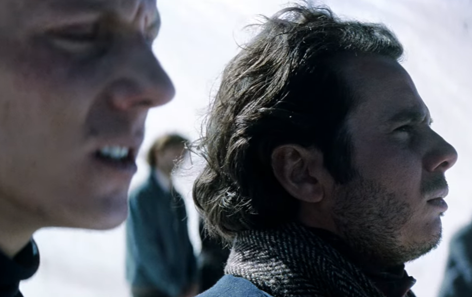 Screenshot of people looking scared outside - from Society of the Snow (2023)