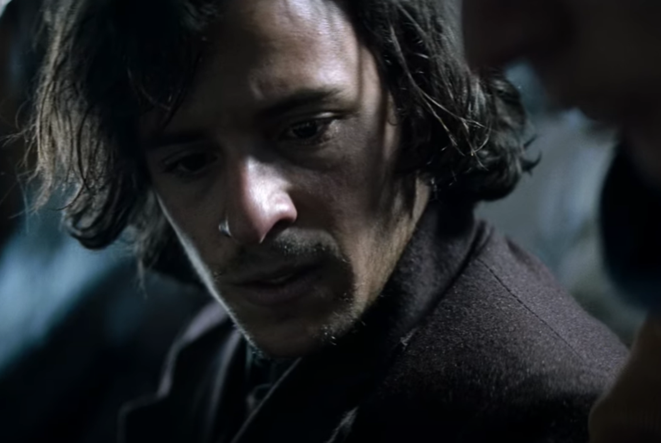 Screenshot of man looking scared outside - from Society of the Snow (2023)