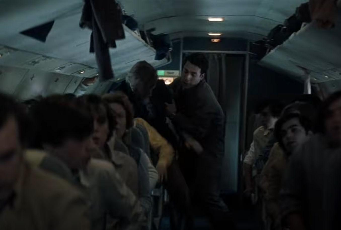 Screenshot of people on board on Flight 571 - from Society of the Snow (2023)