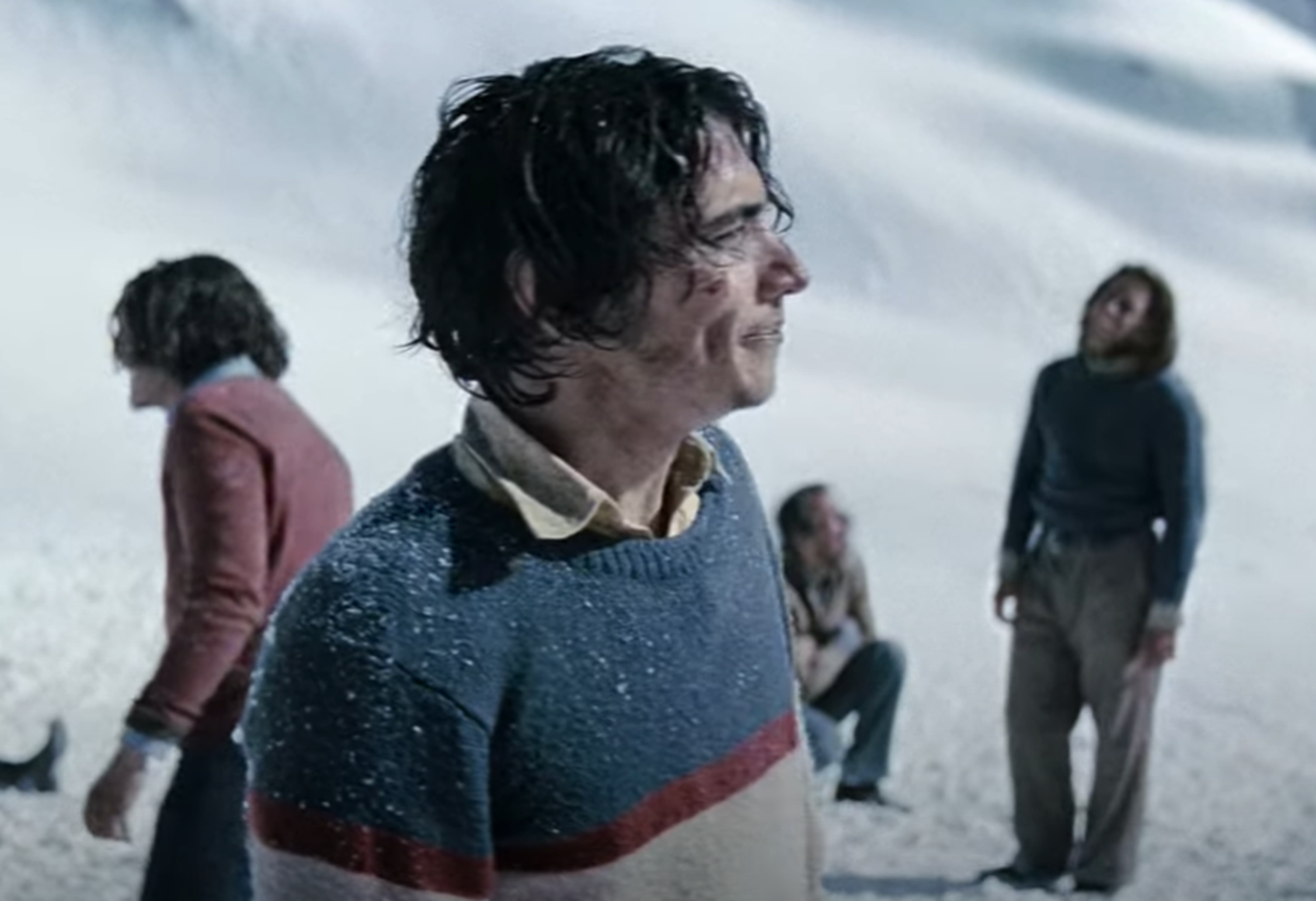 Screenshot of people looking scared outside - from Society of the Snow (2023)