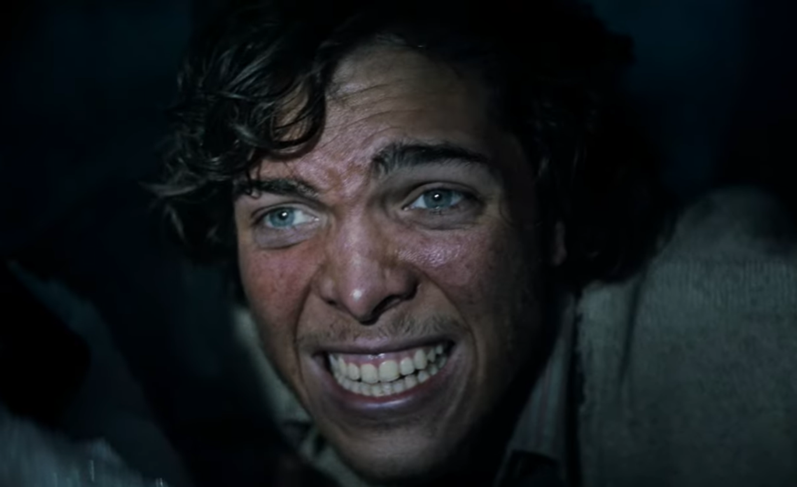 Screenshot of man looking scared - from Society of the Snow (2023)