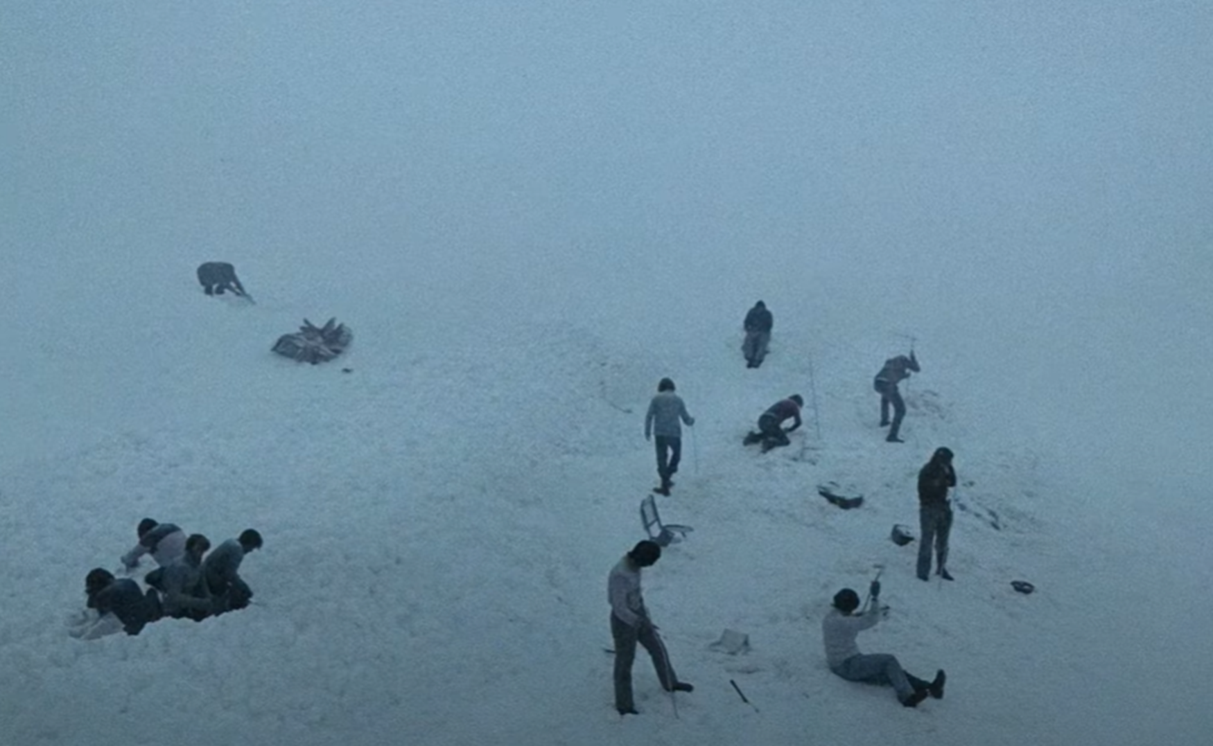 Screenshot of man looking upset outside - from Society of the Snow (2023)