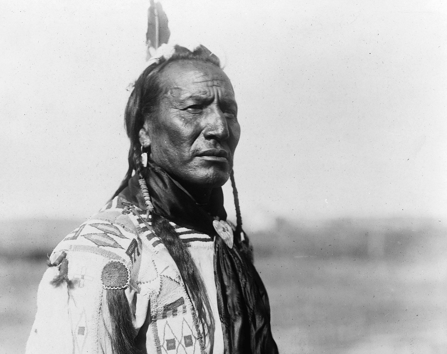 Blackfoot man with braided sweet grass ropes