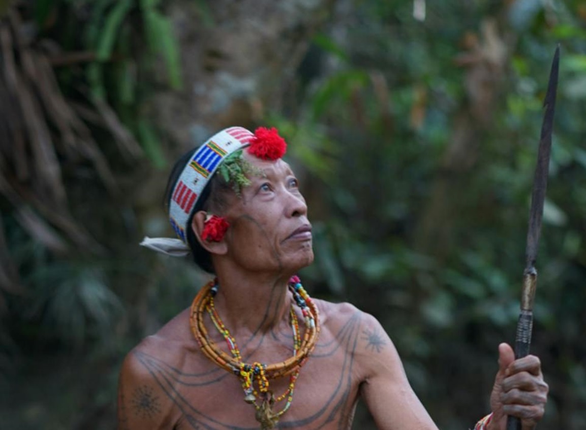 Tribe man holding a spear.