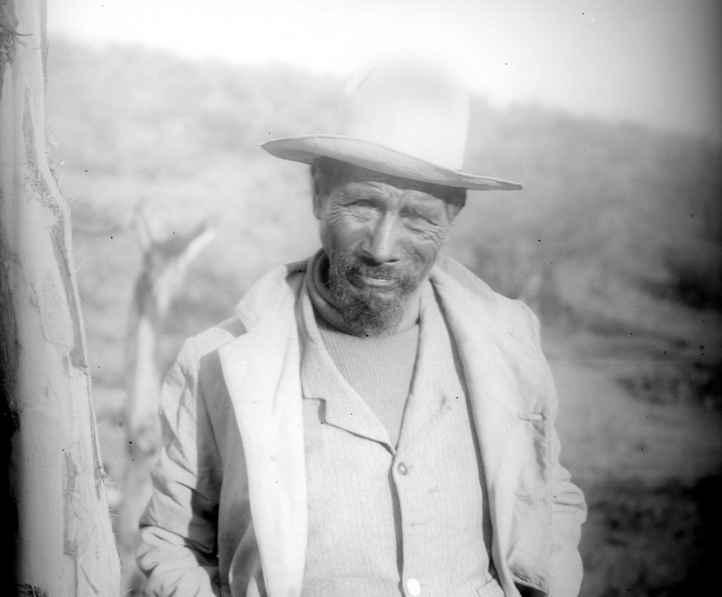 Photographs of a Yaqui Indian man in turtle-neck sweater, vest, and jacket, Arizona, ca.1910.