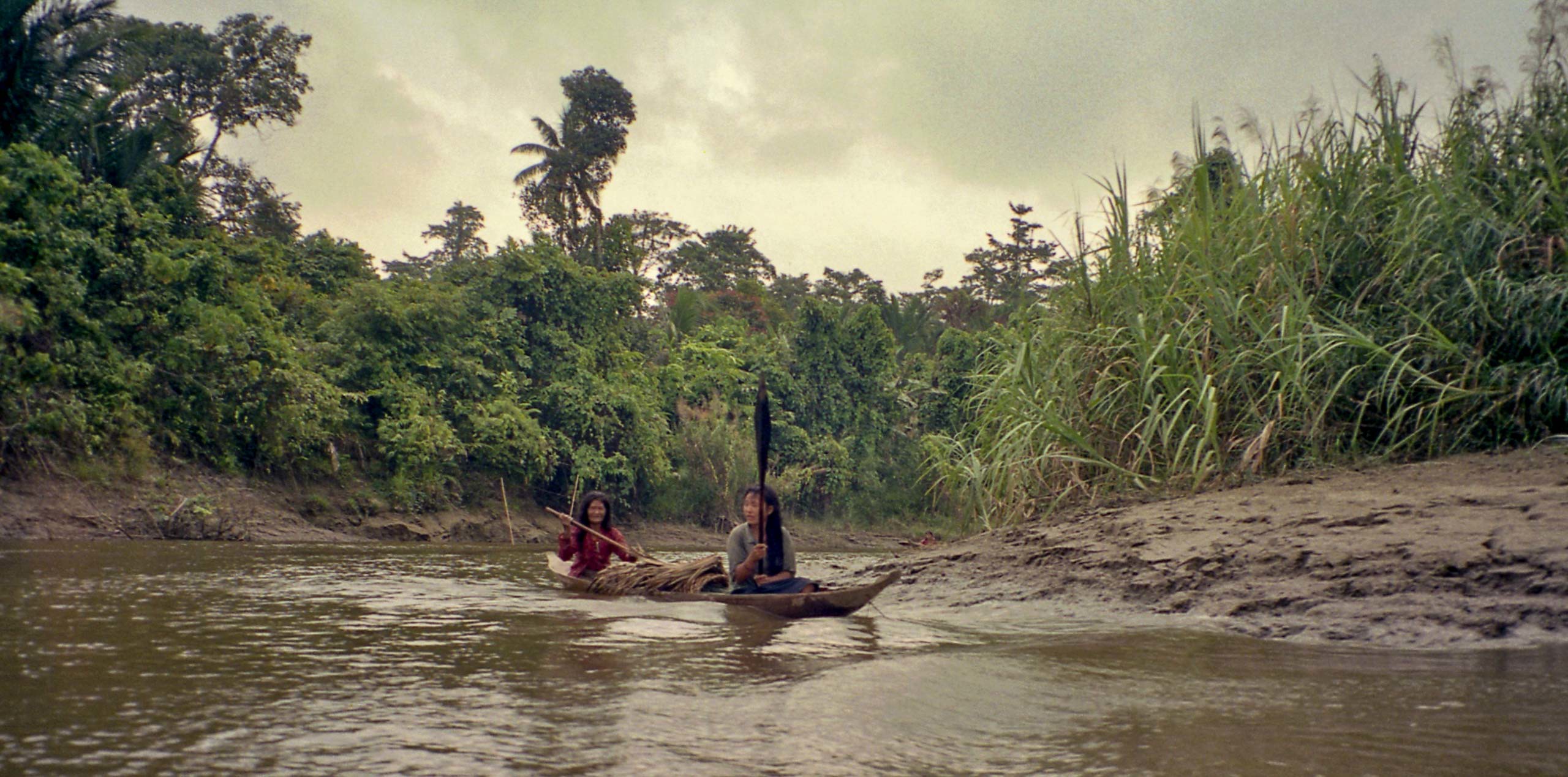Mentawai woman in canoe