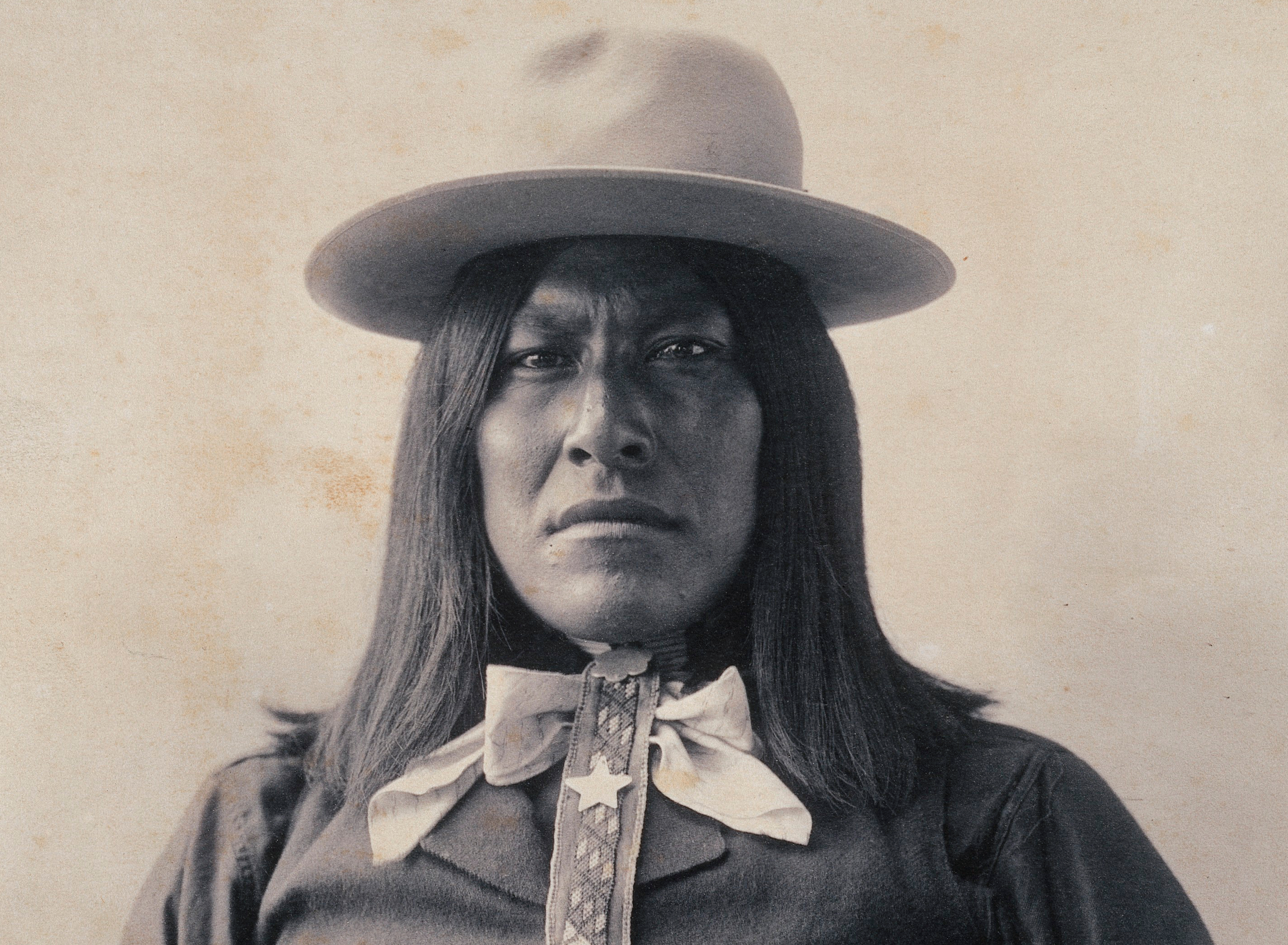 Apache Indian wearing a hat