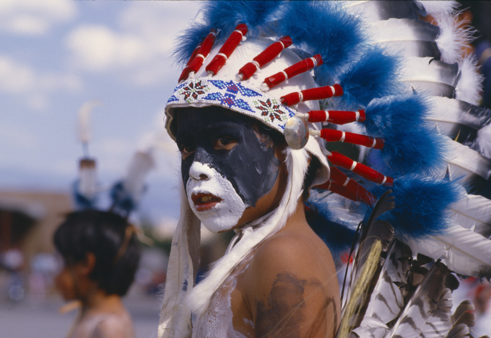 Native American boy with feathered headdress