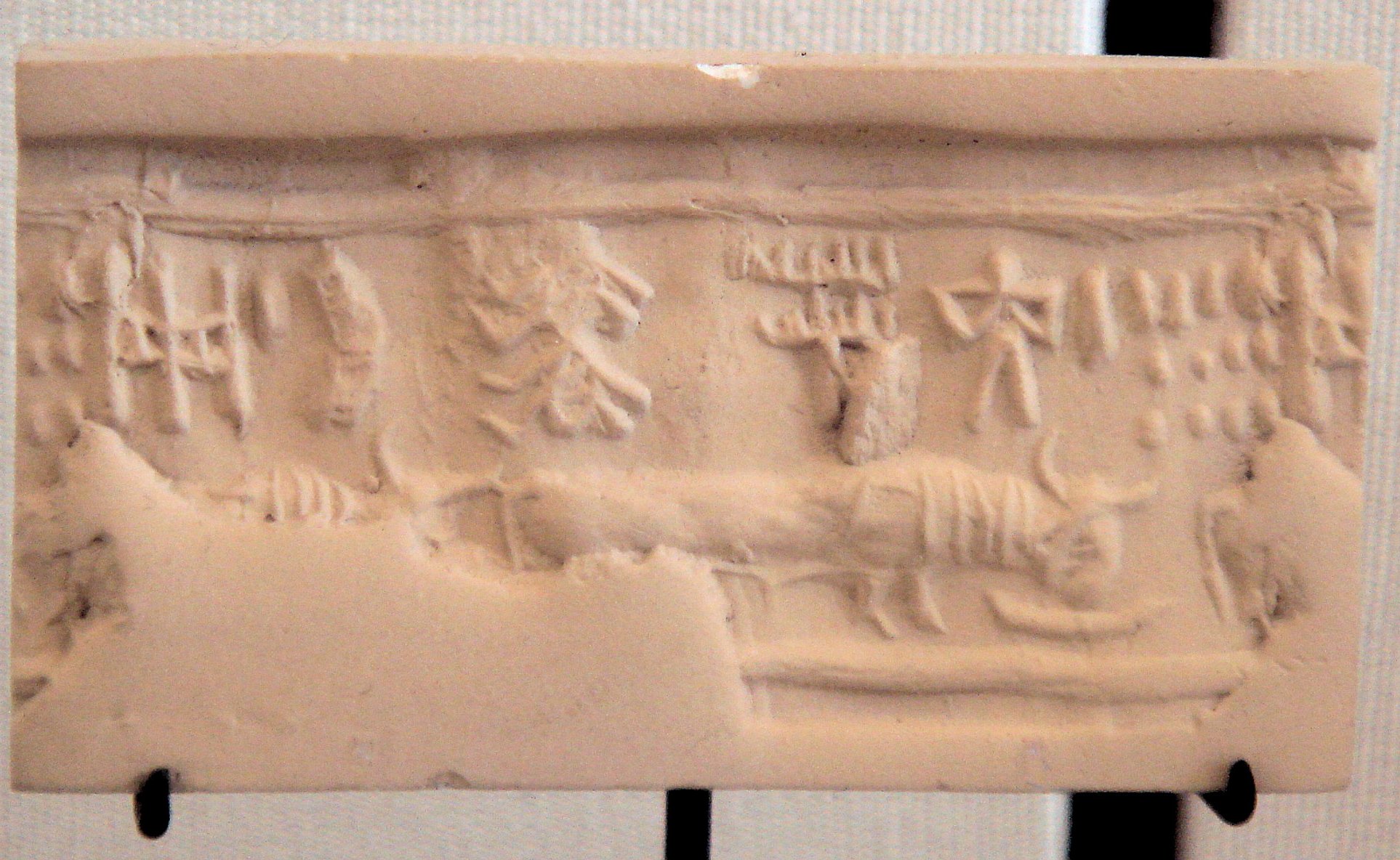 Photo of Indus cylinder seal with elongated buffalo with Harappan script