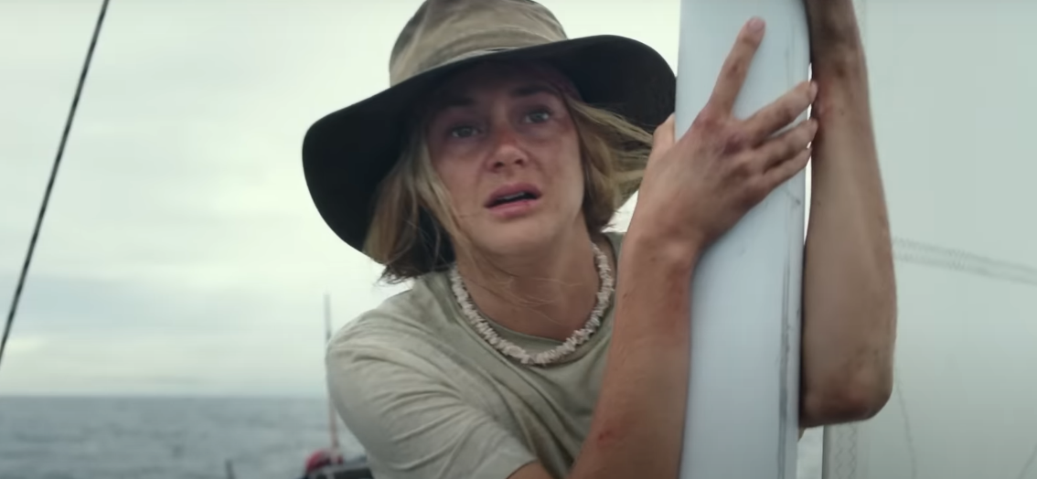 Girl with hat on boat