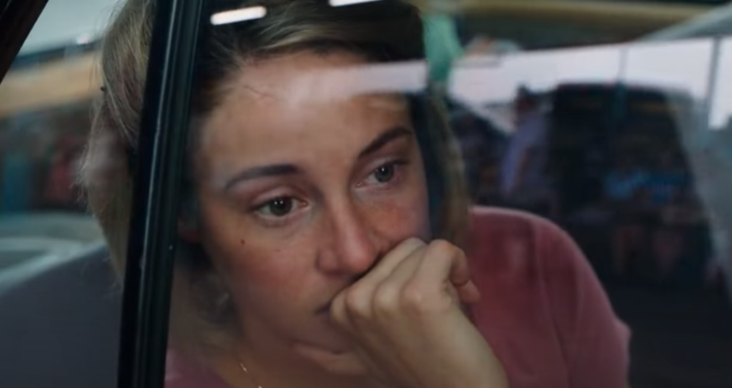 Image of a girl looking through the window