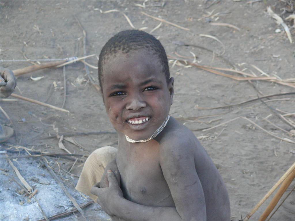 Young Hadzabe boy sitting outside - 2009