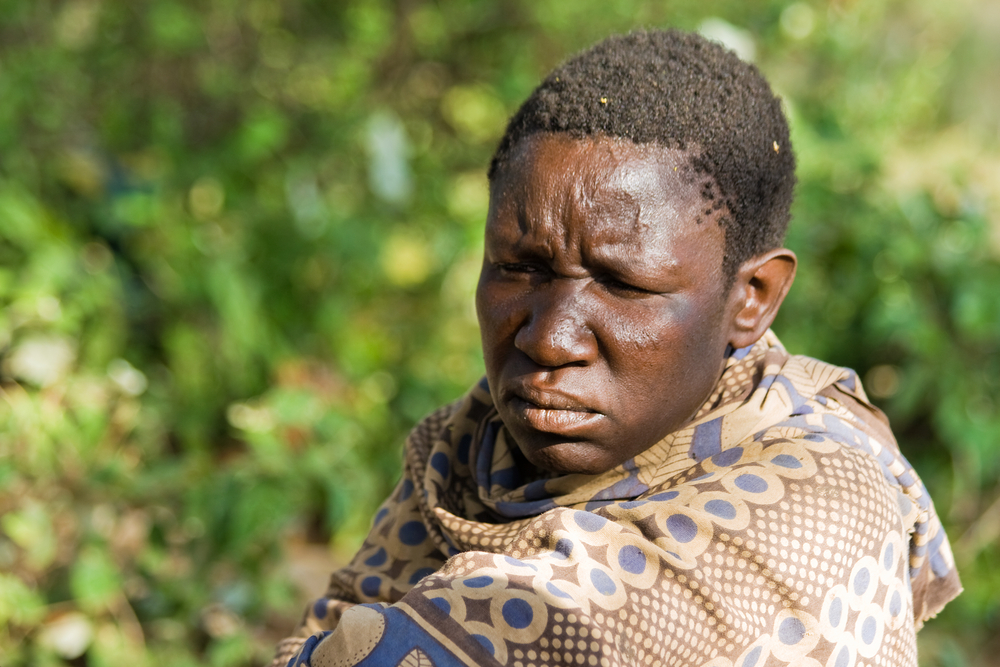 An unidentified Hadzabe woman looks seriously in the bush on February 18, 2013 in Tanzania.