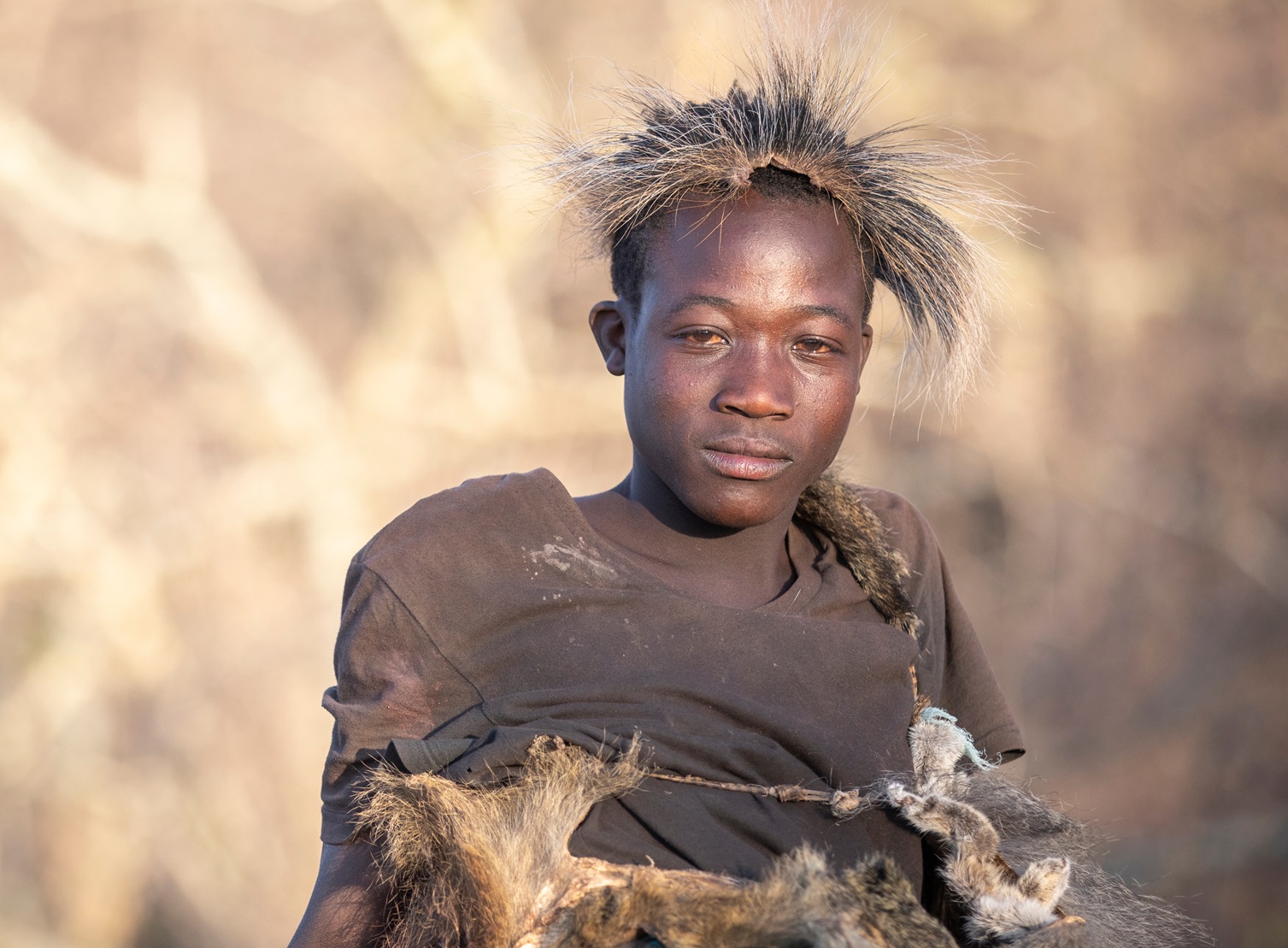Hadzabe man in traditional clothing in a nature of lake eyasi valley - 2019