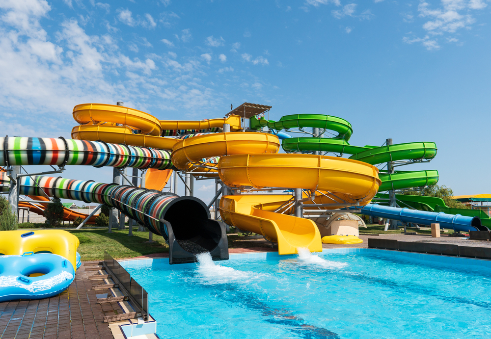 Water park with colorful slides and pools.