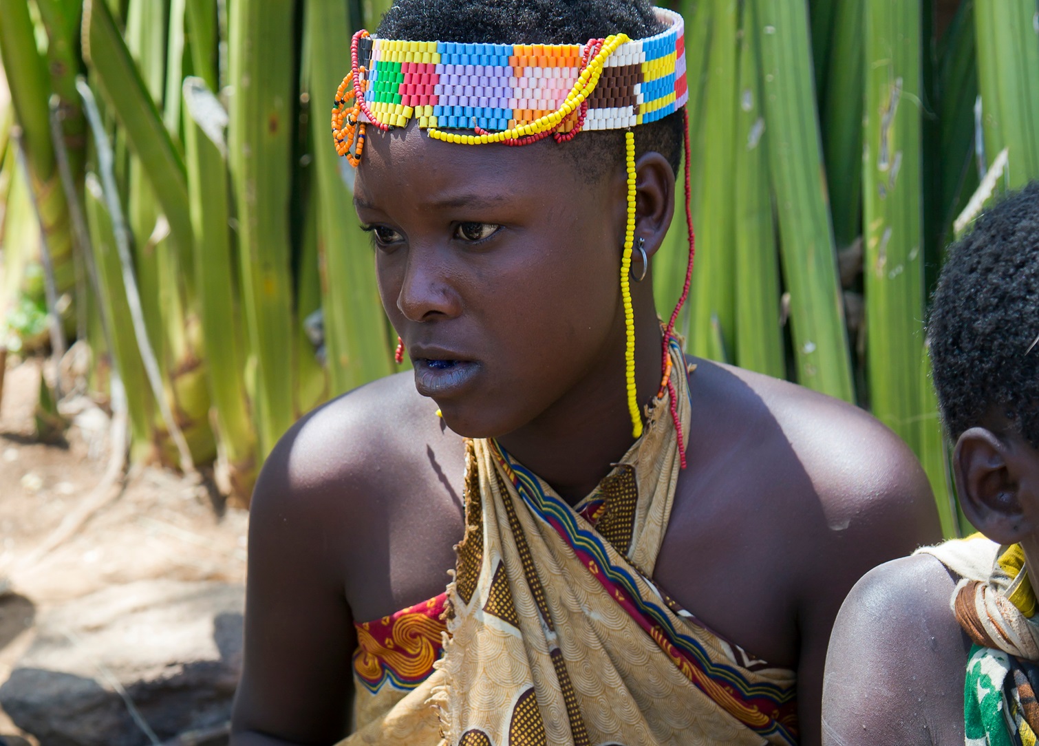 Portrait woman in bead decoration of the Hadzabe tribe.
