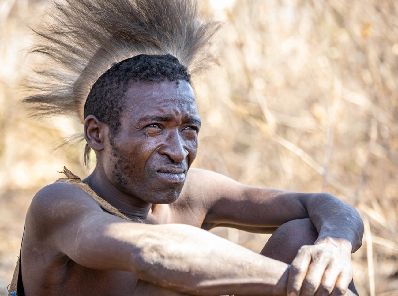 Hadzabe hunter chilling on a resting day - 2020