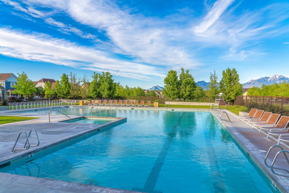 Large public pool surrounded by lounge chairs