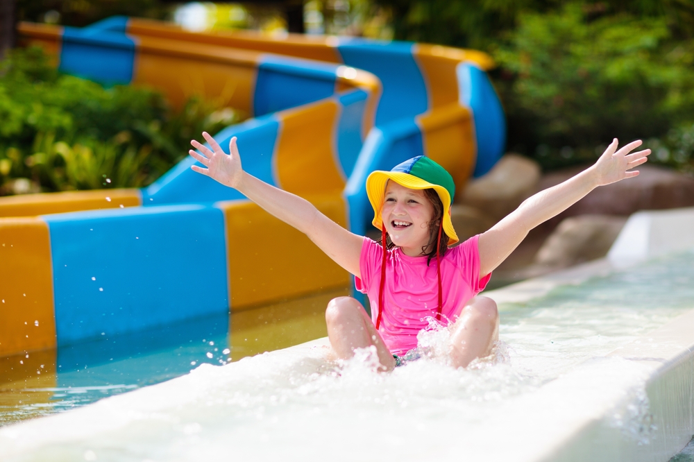 Kids on water slide in aqua park