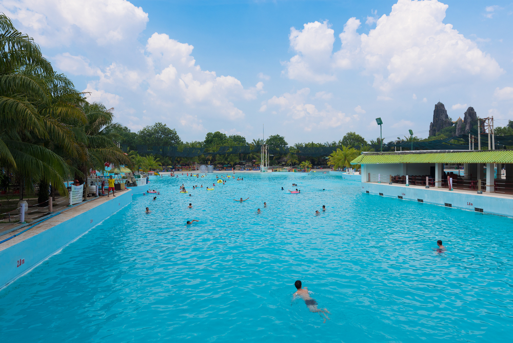 Unidentified people swim in a large pool