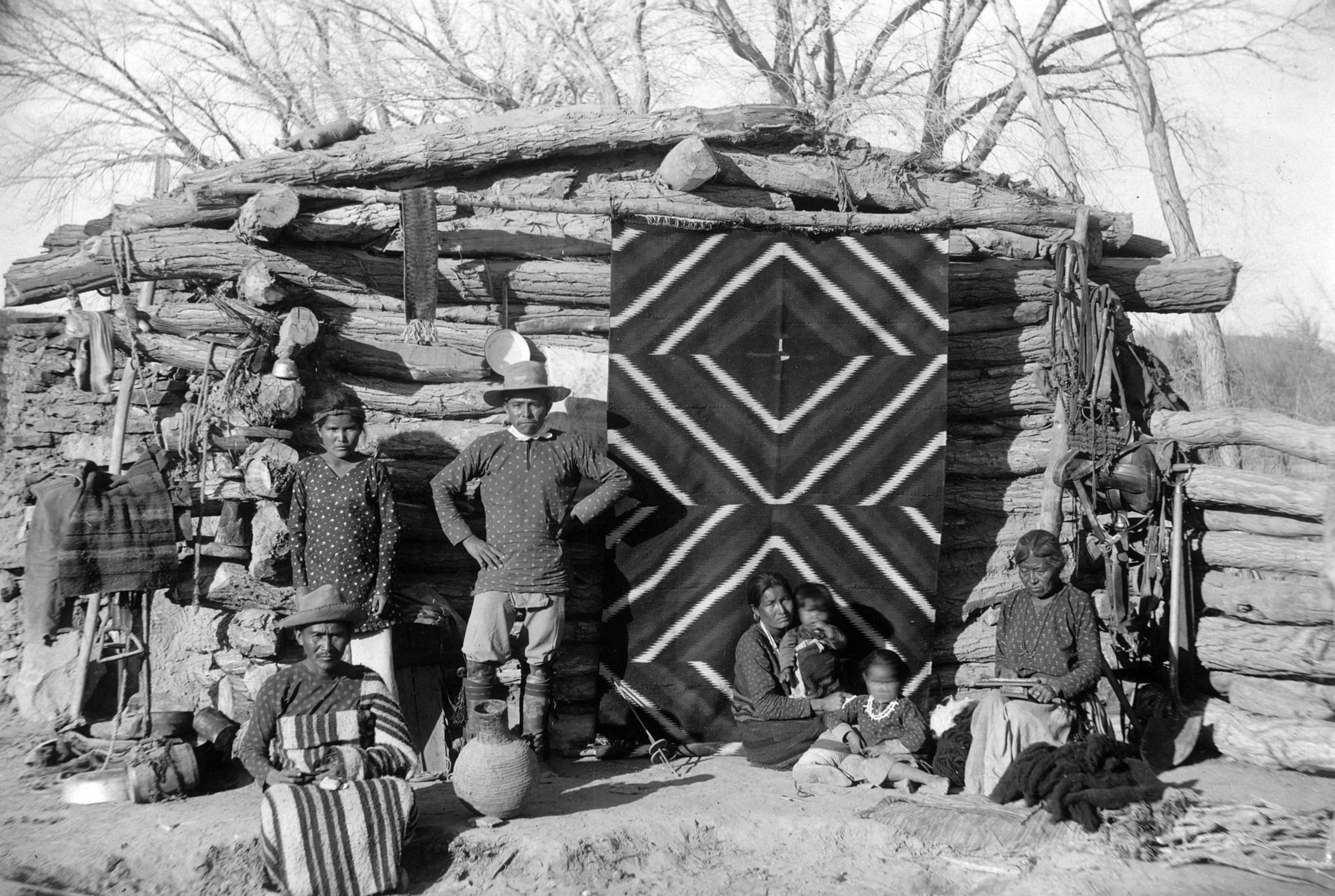 Navajo  family in front of their house