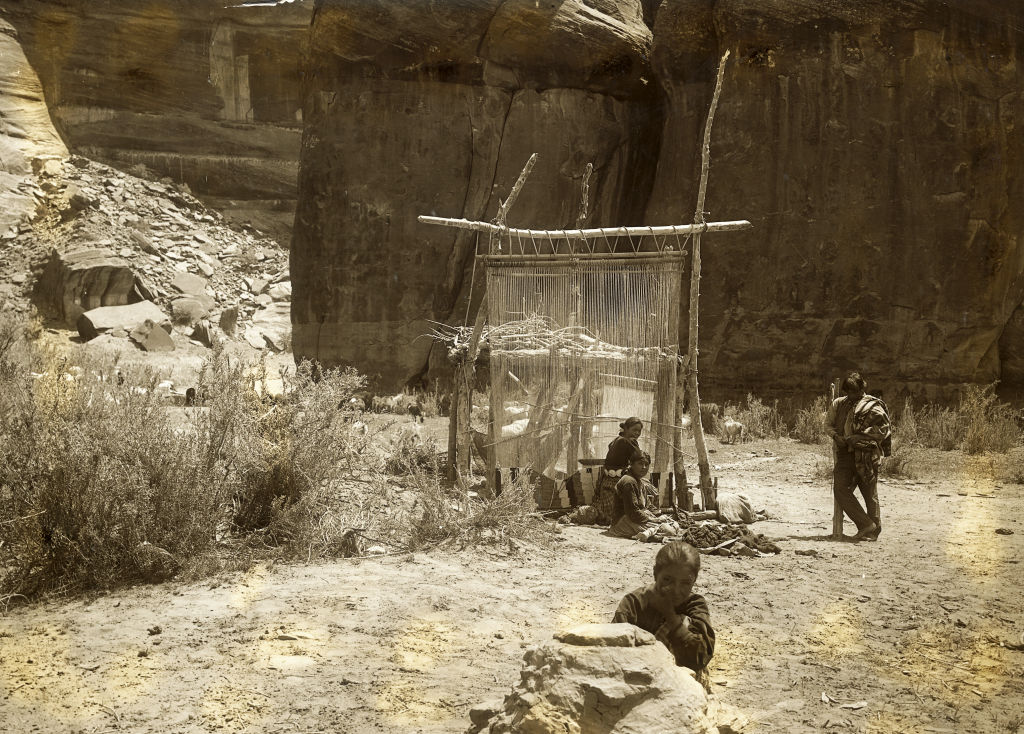 Navajo Indians Weaving Rugs