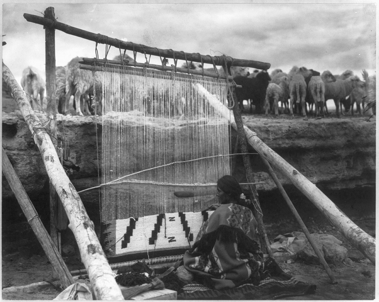 Navajo woman making blanket
