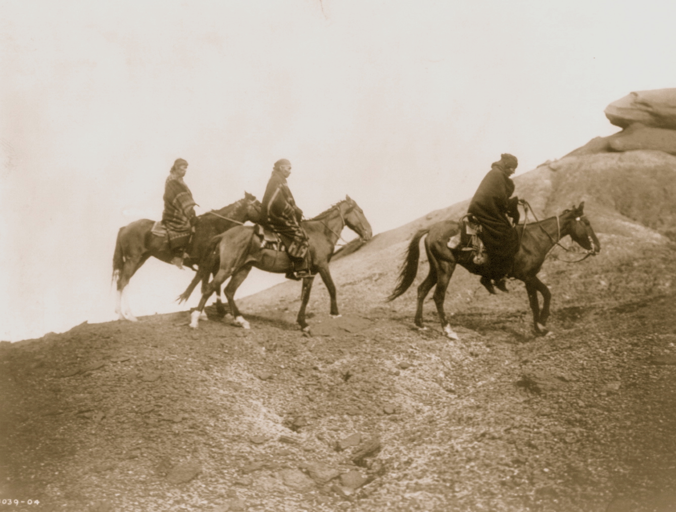 Navajo men on horses
