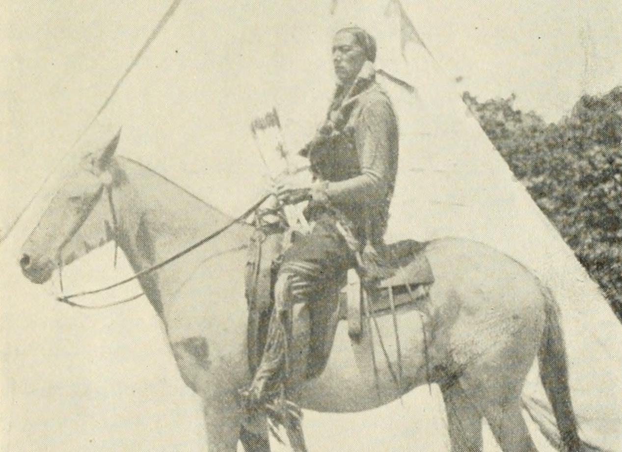 Comanche Indian on horseback.