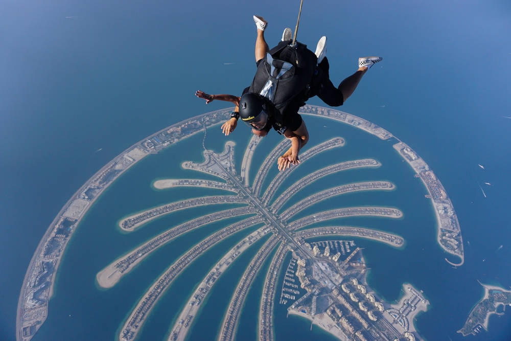 Tandem skydivers hover over Palm Jumeirah ,Dubai