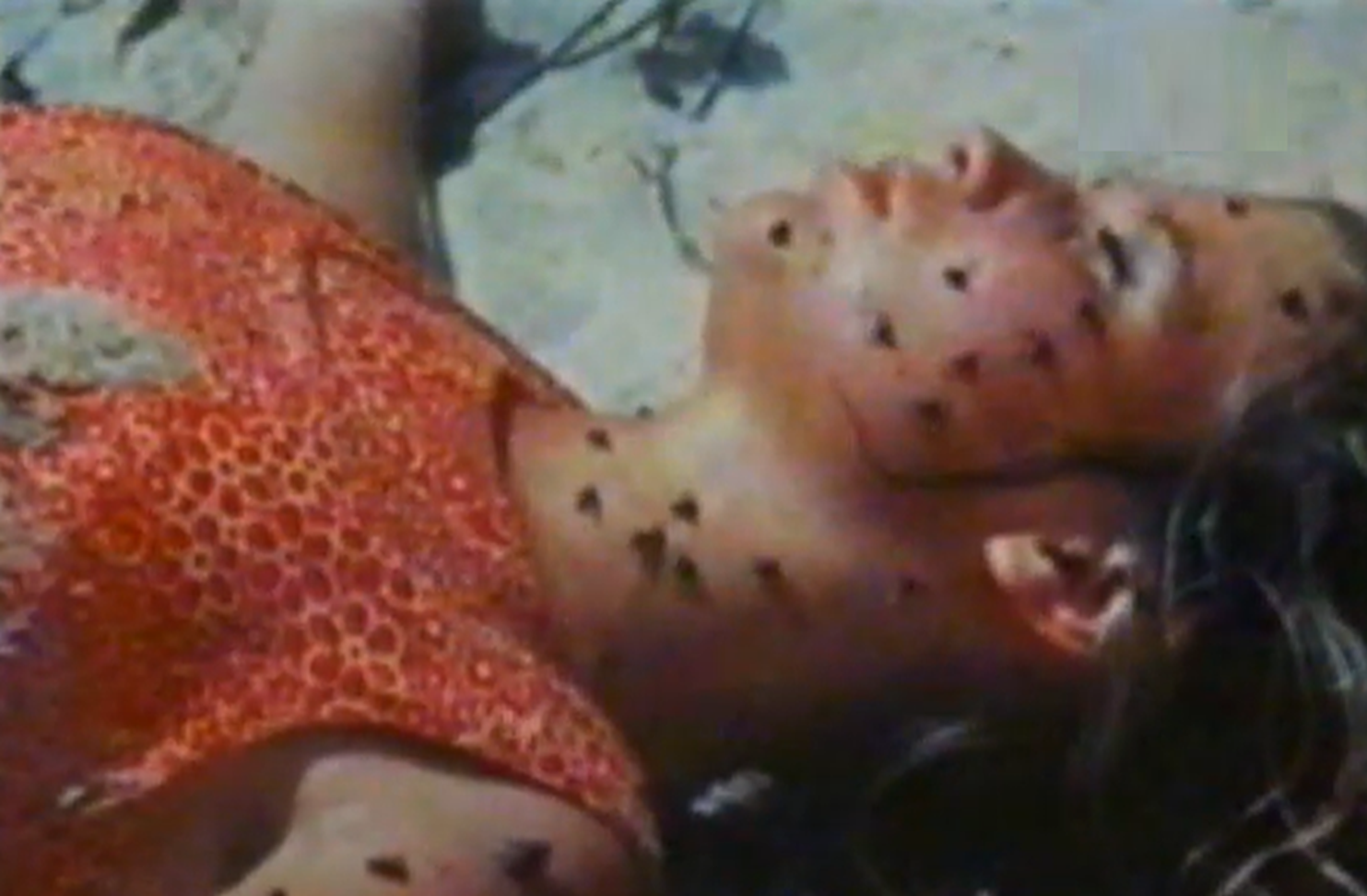 Screenshot of Susan Penhaligon as Juliane Koepcke laying down - from Miracles Still Happen (1974)